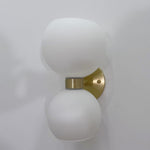 round-white-glass-bedroom-wall-lamp