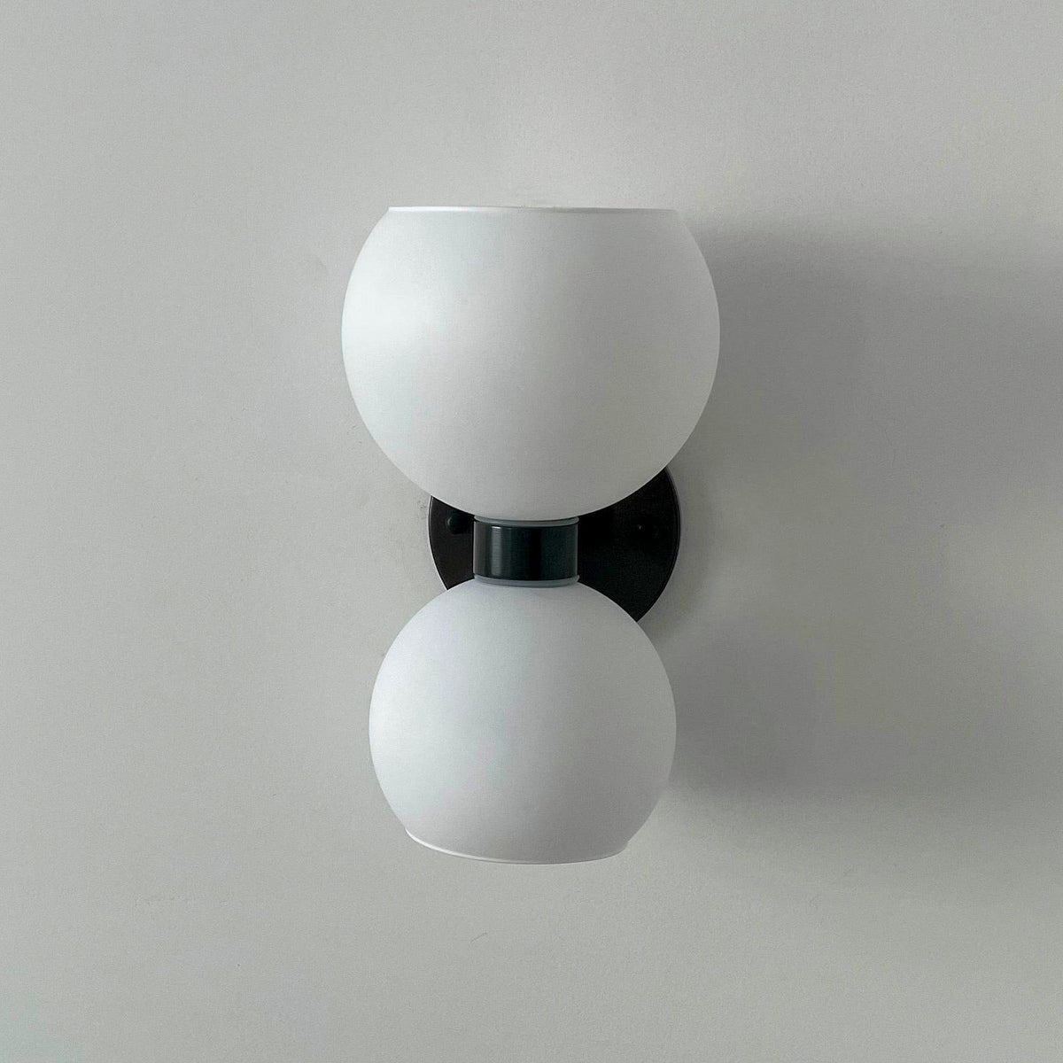 round-white-glass-bedroom-wall-lamp