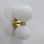 round-white-glass-bedroom-wall-lamp