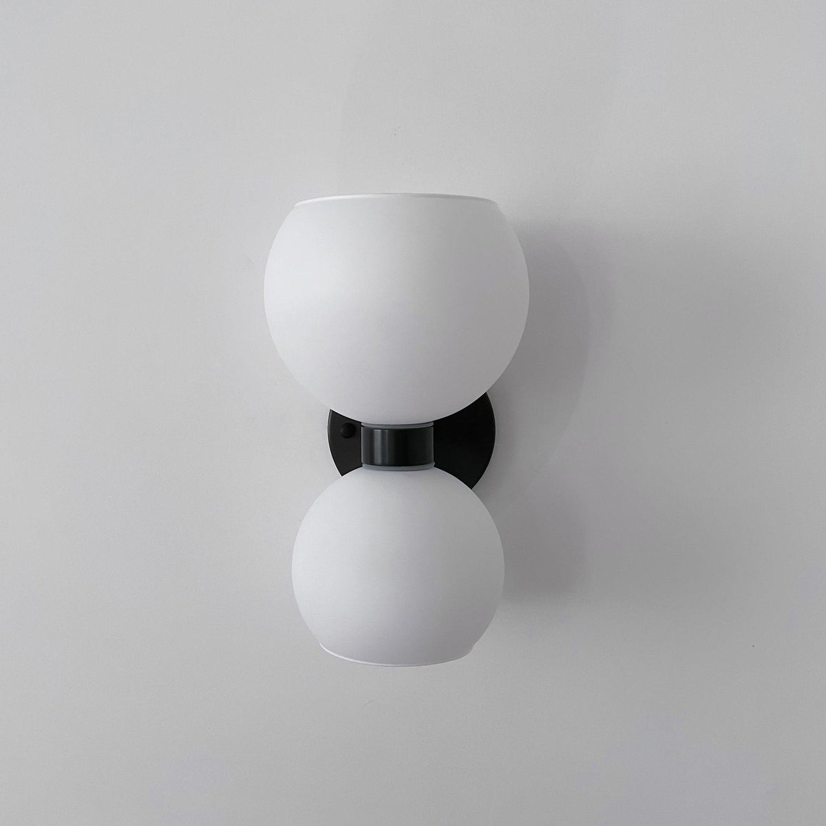 round-white-glass-bedroom-wall-lamp