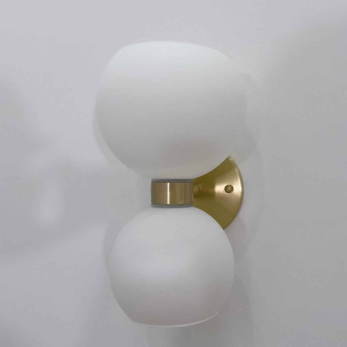 round-white-glass-bedroom-wall-lamp