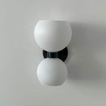 round-white-glass-bedroom-wall-lamp
