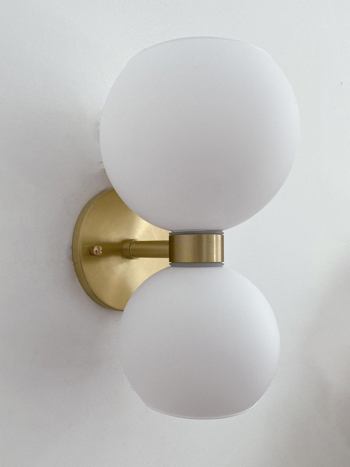 round-white-glass-bedroom-wall-lamp